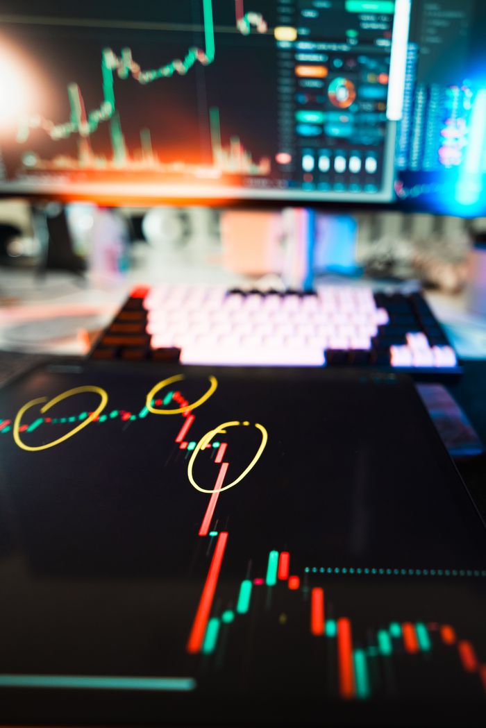 Services Close-up of cryptocurrency market data visualization on screens with highlighted trends and charts.